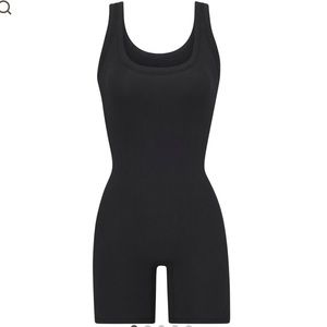 SKIMS signature mid-thigh bodysuit silhouette in color Soot